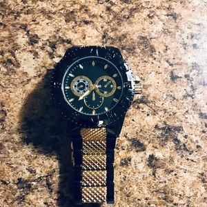 Black and gold stainless steal watch